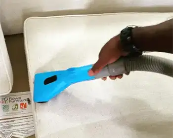 sofa being cleaned