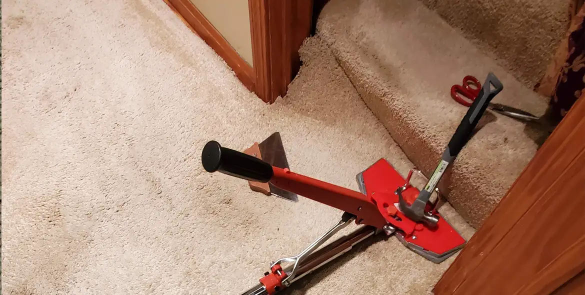 section of carpet being stretched for repair